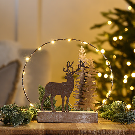 reindeer with tree on base
