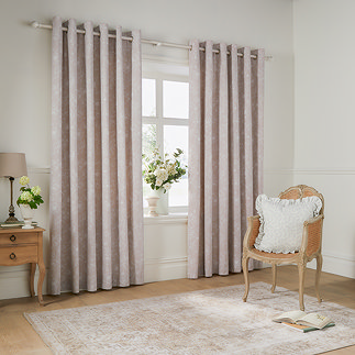 Bella Natural Eyelet Curtains on a window image