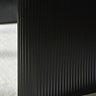 close up image of fluted black legs of dining table