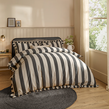 Birdie Black and white duvet cover set on bed image 1