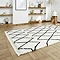 white and black boho rug on floor image 2