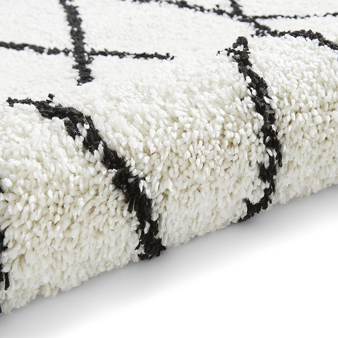 white and black boho rug close up image 9