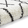 white and black boho rug close up image 9