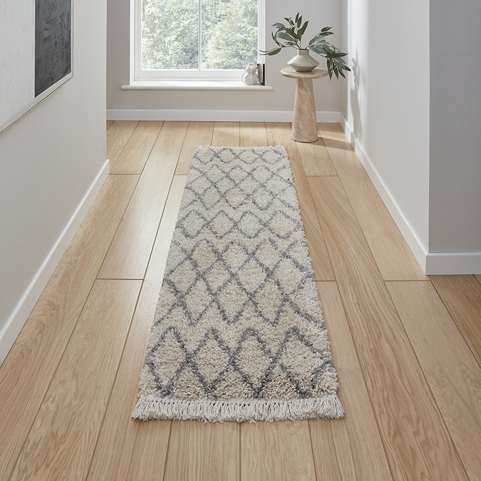 cream and grey runner on floor image 1