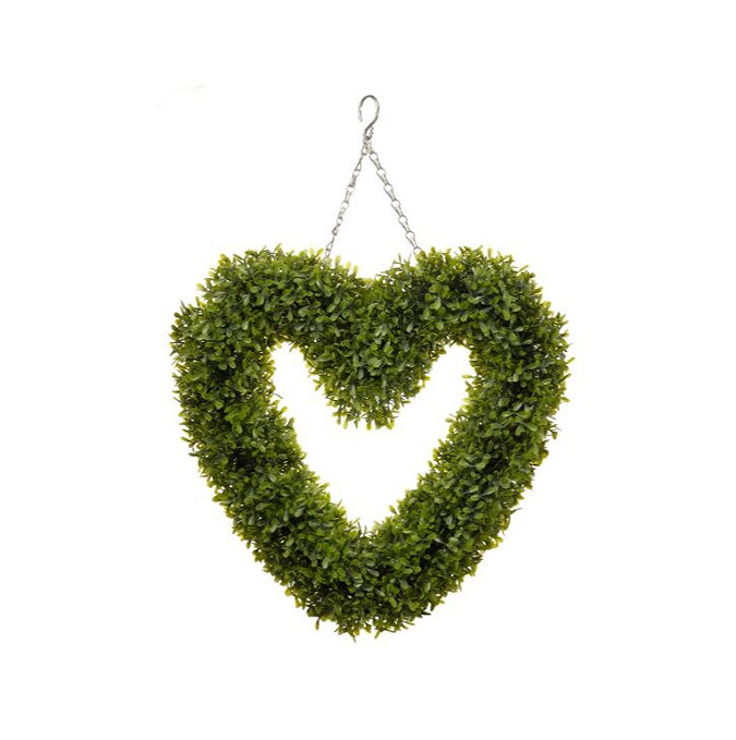 image cut out on white background of heart shaped green wreath with chain