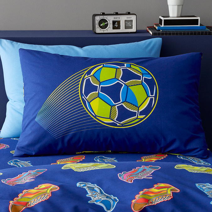 close up image of navy pillowcase with bright football printed on its centre