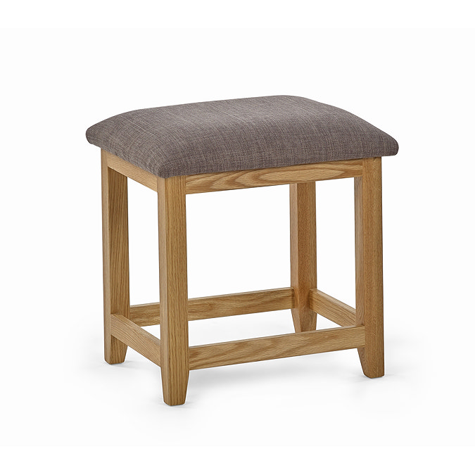 image cut out on white background of oak stool with grey padded top