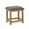 image cut out on white background of wooden stool with padded seat 