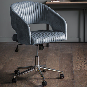 side on cut out image of curved warm velvet swivel chair