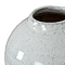 close up on mouth of olpe vase in white ceramic
