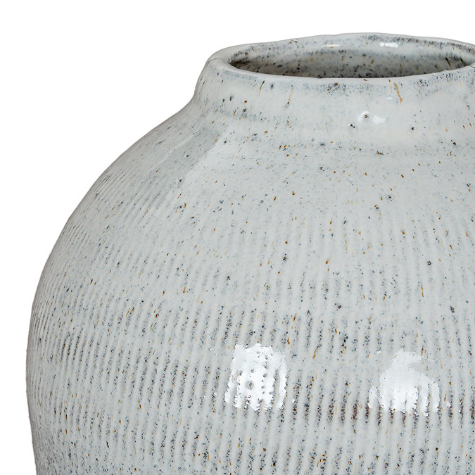close up image of rounded edge of ceramic olpe vase