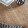 close up on wood of round coffee table