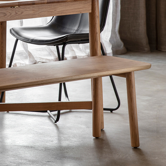 close up on right corner of solid oak dining room bench