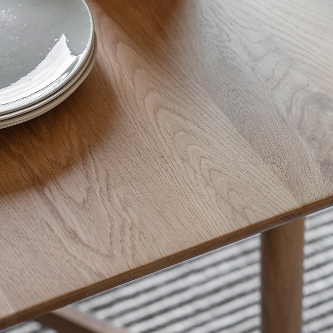 close up on wood grain of solid oak dining table