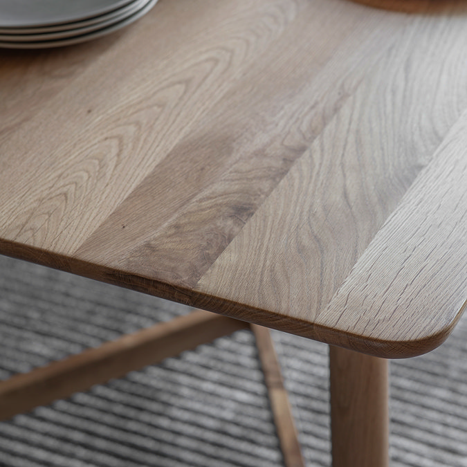 close up on smooth edge of solid oak dining table