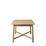 side on image of light oak dining table, cut out on white background