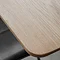 close up on corner of solid oak dining table with smooth edges