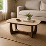 lifestyle image of rectangular stone coffee table with walnut base, in neutral room setting