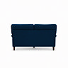 back facing cut out image of navy blue velvet sofa with dark wood legs