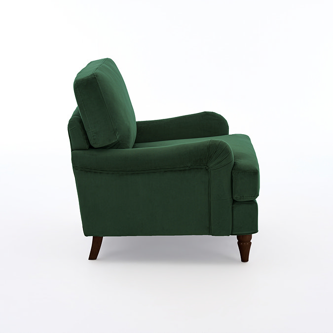 side on cut out image of forest green velvet armchair