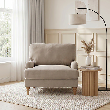 image of mink brown velvet armchair with light wood legs on plush rug