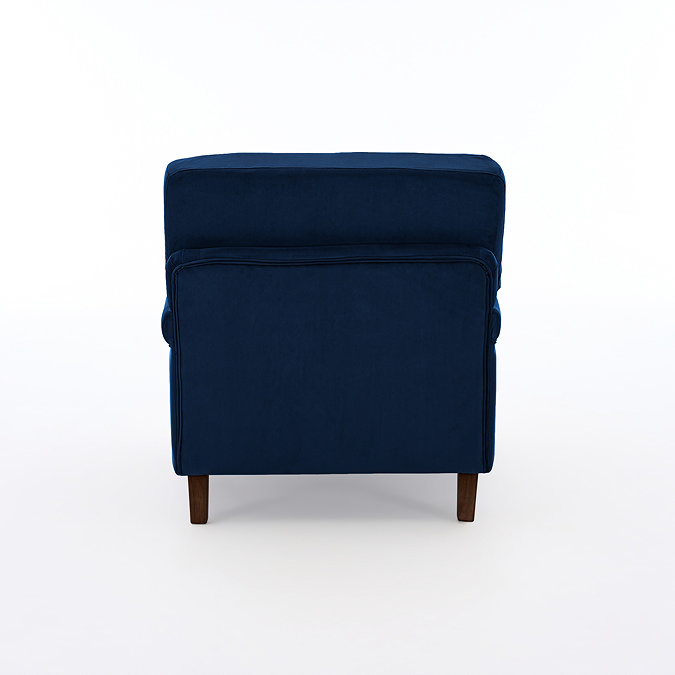 back facing cut out image of navy blue velvet armchair with dark wood legs