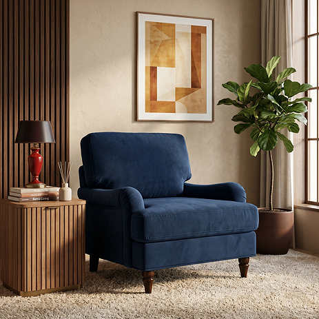 image of navy blue velvet armchair with dark wood legs