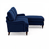 side on cut out image of navy blue velvet corner sofa with dark wood legs