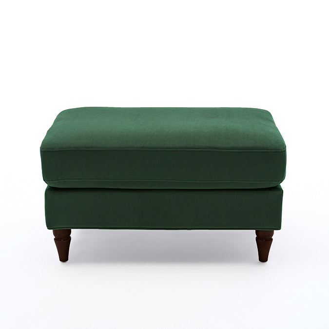 side on cut out of forest green velvet pouffe with warm wood legs