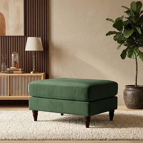 image of velvet green pouffe with warm wood legs
