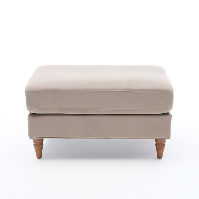 side on image of mink velvet pouffe with light wood legs