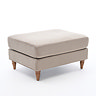angled image of mink velvet pouffe with light wood legs