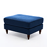 cut out image of navy blue pouffe with dark wood legs