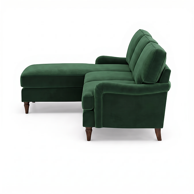 side on cut out image of velvet green corner sofa with dark wood legs