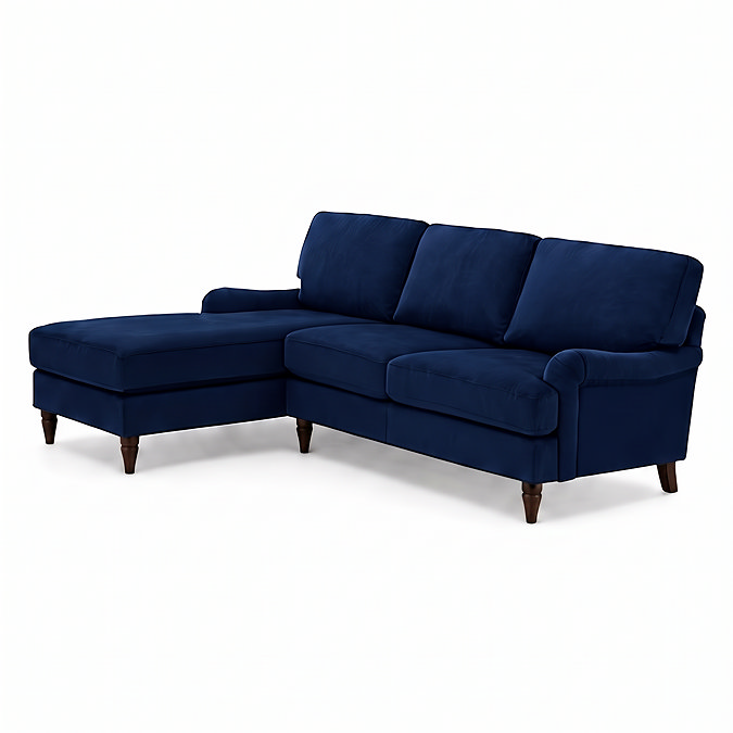 angled cut out image of navy blue velvet corner sofa with dark wood legs
