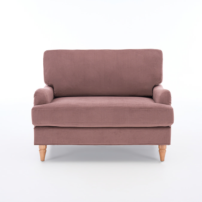 front on cut out image of blush pink snuggle chair with light wood legs