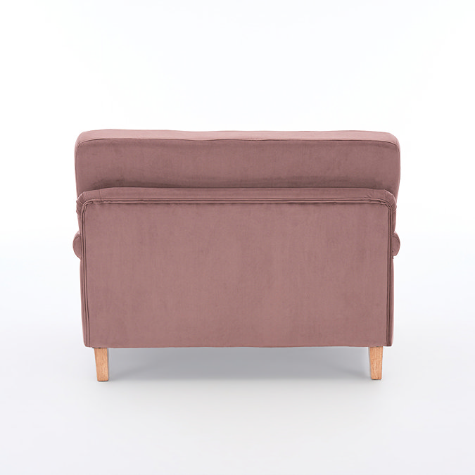 back cut out image of blush pink velvet snuggle chair with light wood legs