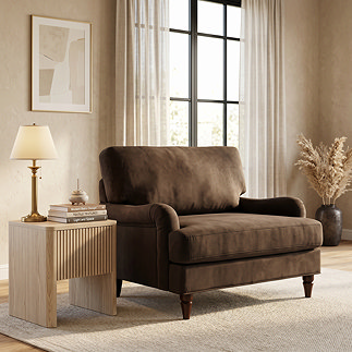 image of brown velvet snuggle chair with dark wood legs