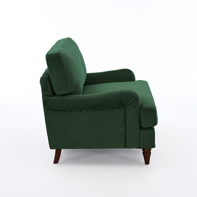 side on cut out image of forest green velvet snuggle chair with dark wood legs