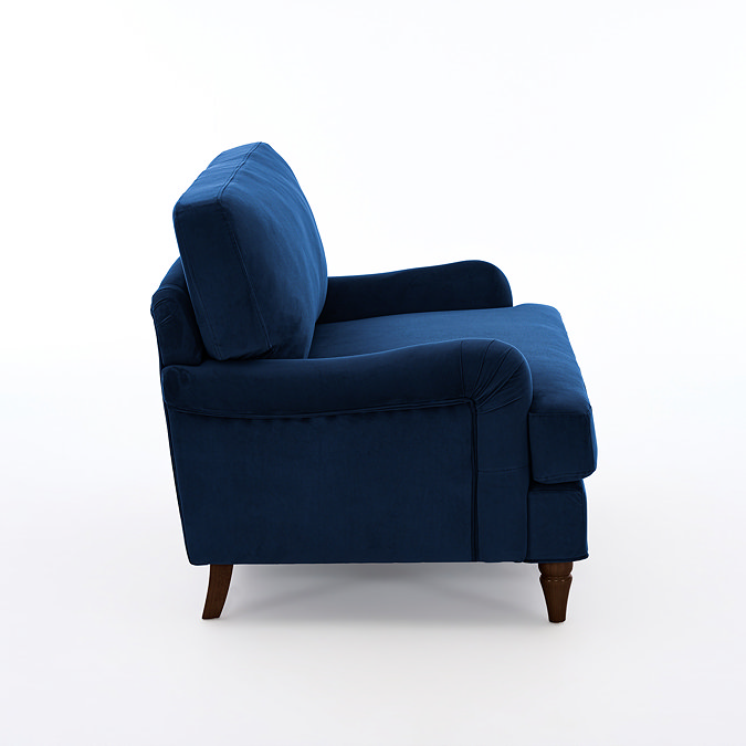 side on image of navy blue velvet snuggle chair with dark wood legs