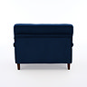 back facing cut out image of navy blue velvet snuggle chair with dark wood legs