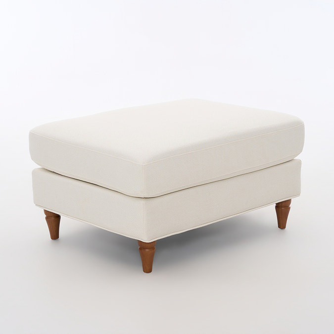 angled cut out image of beige woven fabric pouffe with warm wood legs