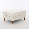 angled cut out image of beige woven fabric pouffe with warm wood legs