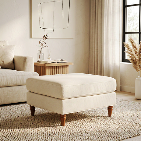 image of woven fabric beige coloured pouffe with warm wood legs