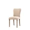 image cut out on white background of natural coloured upholstered dining chair with bobbin front leg detail