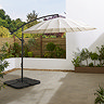 image of ecru parasol over empty sunny patio