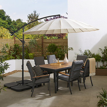 image of ecru parasol over empty sunny patio