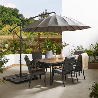 image of large grey parasol over 6 seat rectangular dining table