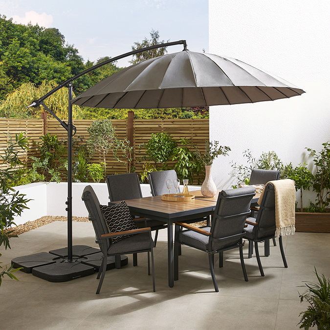 image of large grey parasol over 6 seat rectangular dining table