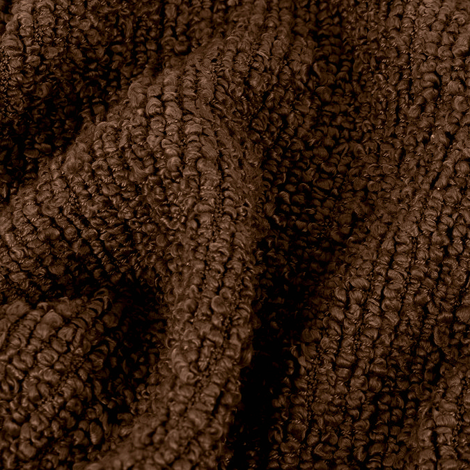 close up image on boucle texture of dark brown throw